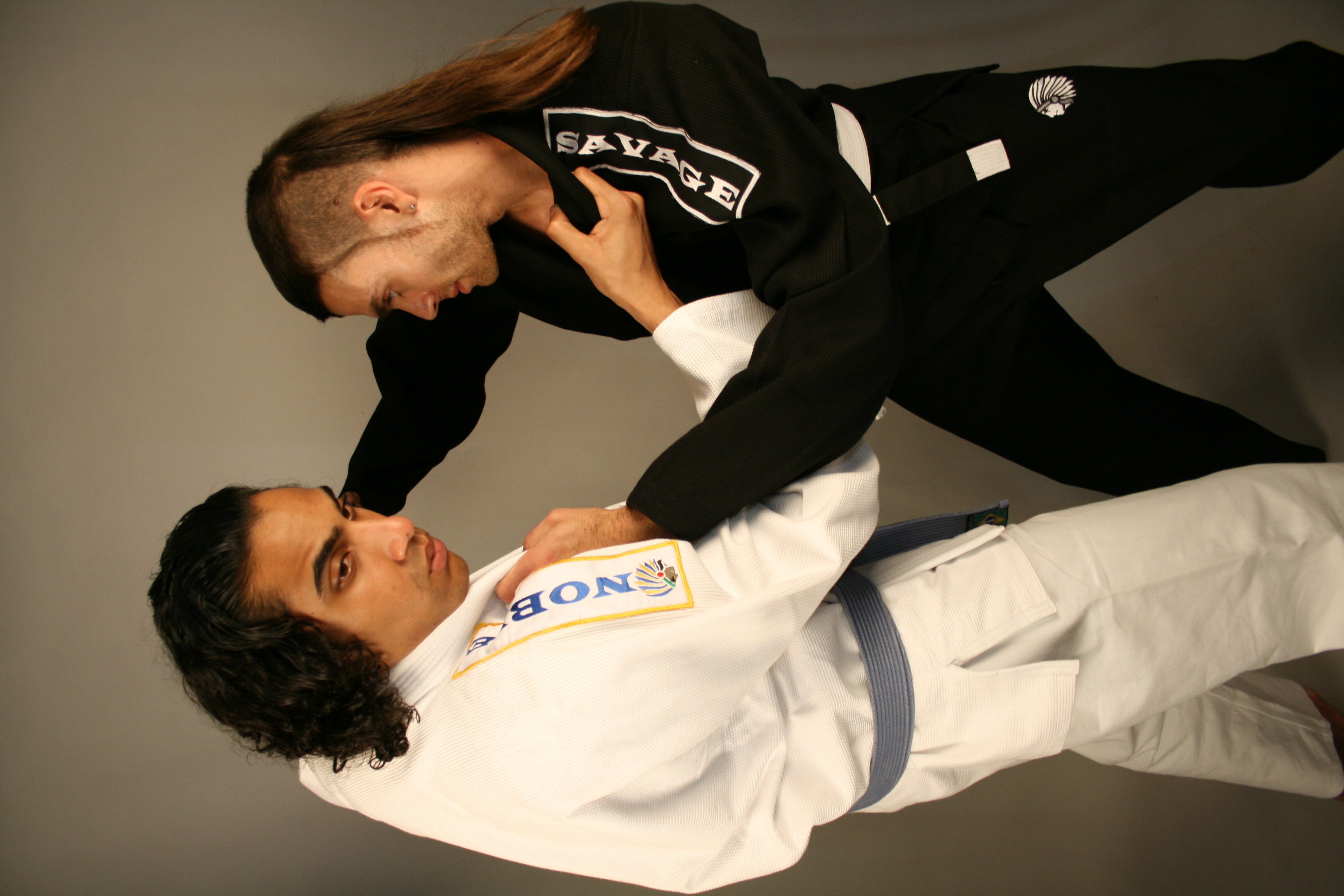 Model in an oversized Noble Savage varsity jacket